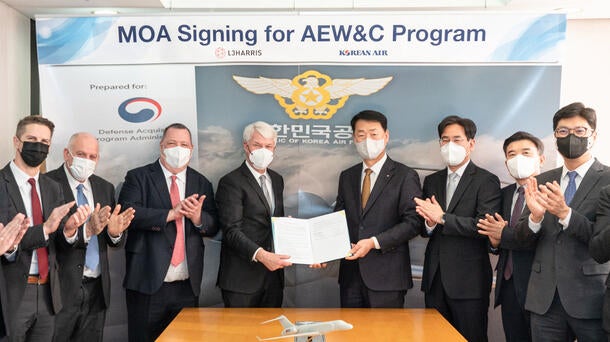 Team of people clapping and holding agreement