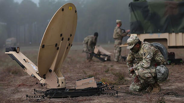 Soldier with VSAT SATCOM terminal in the field