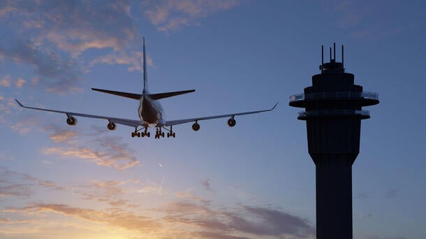 aircraft beside air traffic control (atc) tower