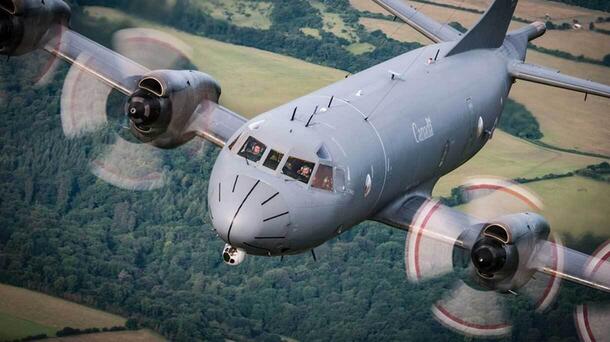 RCAF plane in flight over field