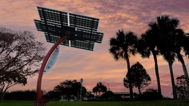 Solar panel outside of a L3Harris facility at dusk