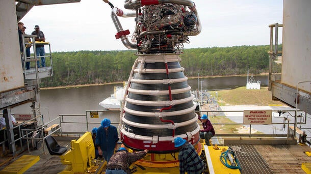 NASA Stennis teams conducted a successful lift onto the Fred Haise Test Stand of RS-25 engine No. E20001, the first of 24 new production engines. Photo credit: NASA Stennis.
