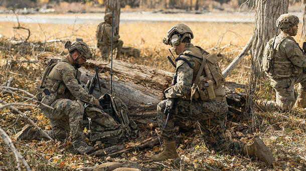Joint forces warfighters with communications equipment