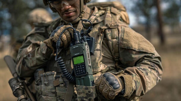 Joint Forces soldier with AN/PRC-163 handheld radio