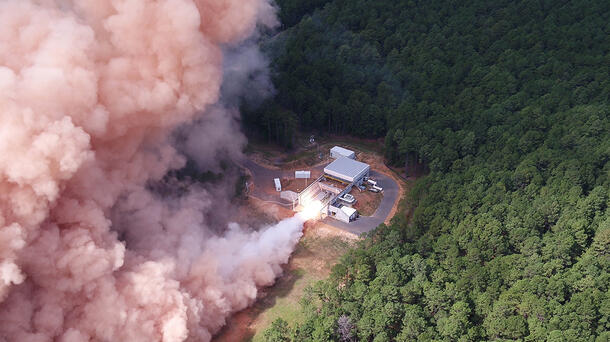 A rocket motor test fires at a facility