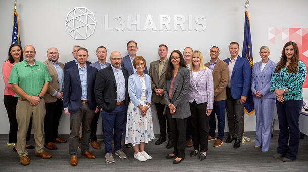 Group photo of Indiana Congressional delegation staff welcomed by L3Harris staff at L3Harris' Fort Wayne manufacturing facility