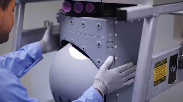 Employee assembles turret sensor