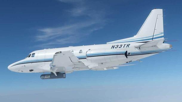 Airplane in flight as viewed through another aircraft