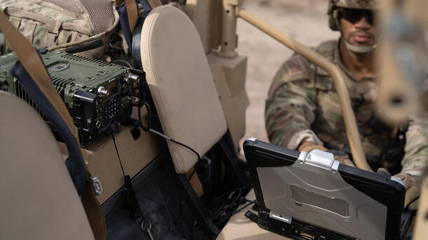 Soldier using laptop with NGC2 at mobile TOC