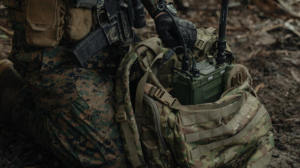 Soldier in camouflage using ARGUS HF radio