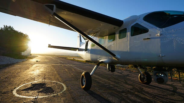 Plane with sunset in the distance