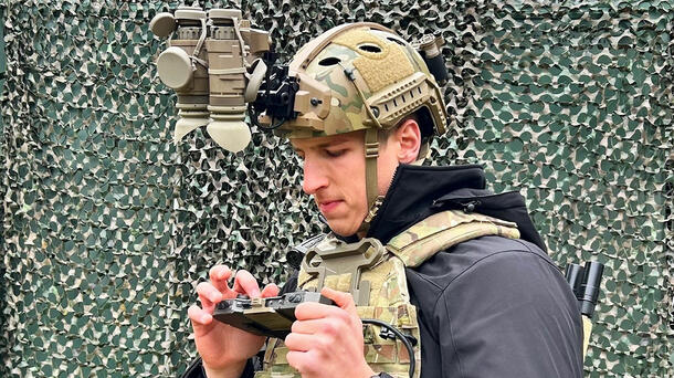 Soldier inspects his devices