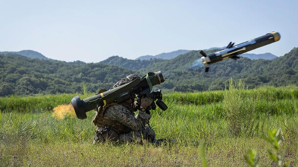 A soldier fires a javelin missile