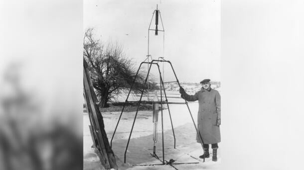 Dr. Robert H. Goddard and a liquid oxygen-gasoline rocket in the frame from which it was fired on March 16, 1926, at Auburn, Massachusetts. Credit: NASA