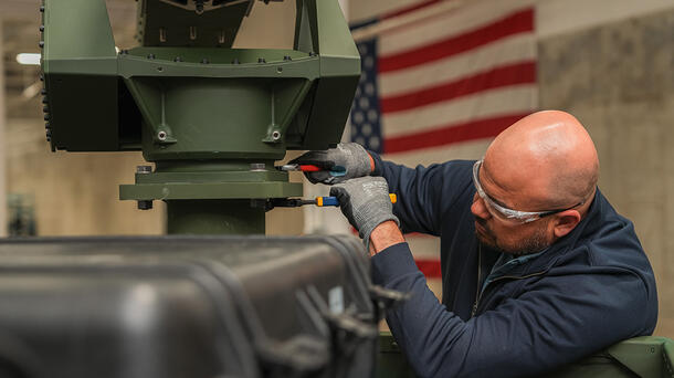 An L3Harris employee works on the company's new high-volume production line for VAMPIRE™