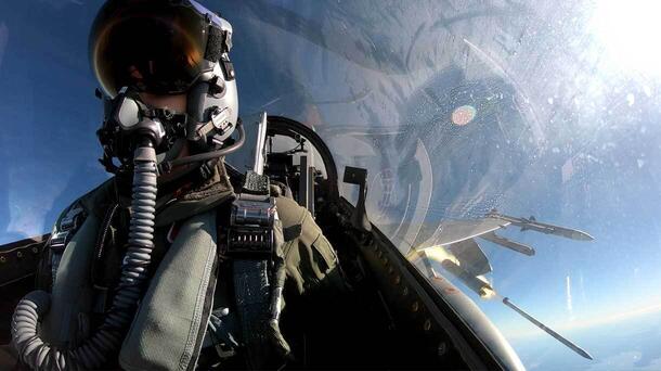 pilot in cockpit with missile out the window