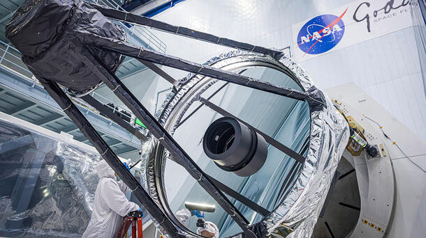 Optical Engineer Bente Eegholm performs and inspection of Roman's Primary mirror. This was taken shortly after it was lifted out of the shipping container. Credit: NASA/Chris Gunn