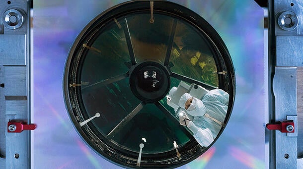 Engineer inspects NASA's Nancy Grace Roman Space Telescope's primary mirror at the L3Harris facility in Rochester, New York. Credit: NASA