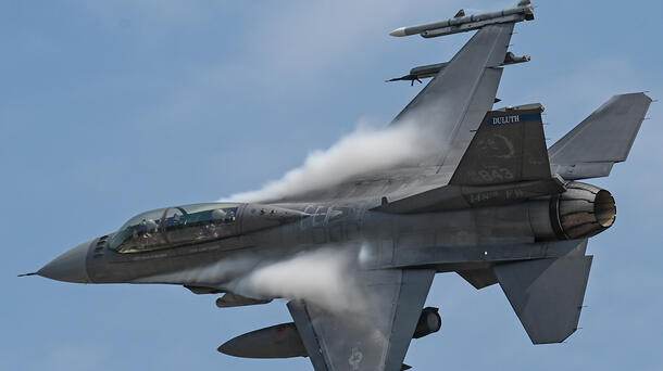 An F-16 Fighting Falcon with the Minnesota National Guard soars through the air above Duluth, Minn.
