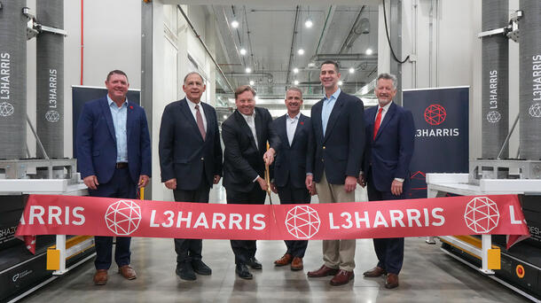 Ribbon cutting ceremony with company executives