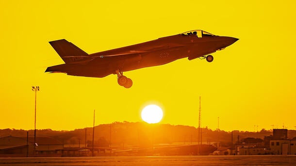 F-35 takes off from tarmac at sunrise