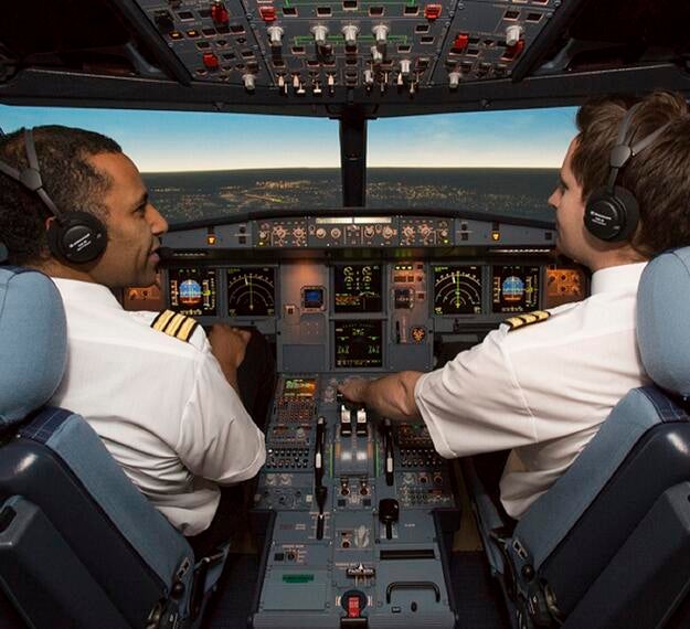 two pilots in a full flight simulator