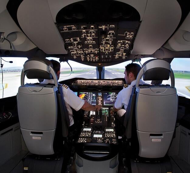 pilot and captain in full flight simulator taking off