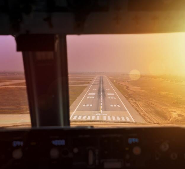 Commercial aircraft on final approach cockpit view