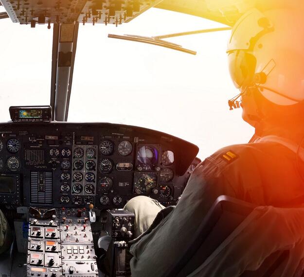 Military helicopter pilot in cockpit