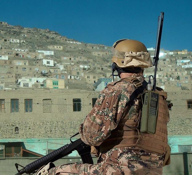 Soldier wearing handheld Falcon® Radio