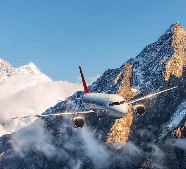 Aircraft flying over mountains