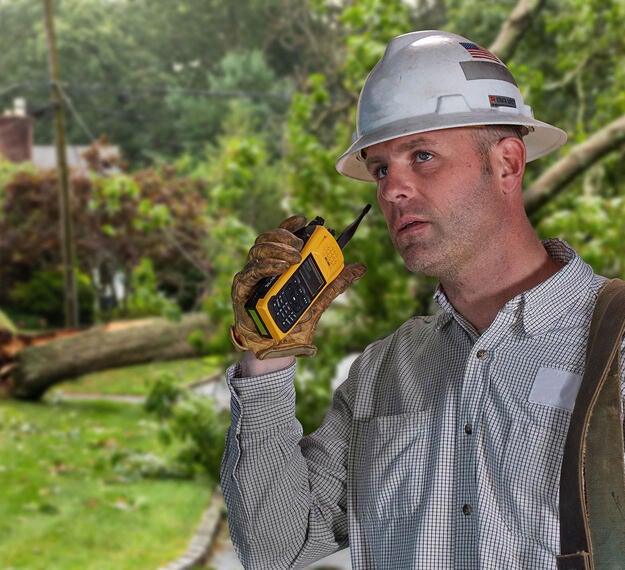 Utility worker with XL Converge™ 185P P25 Portable Radio