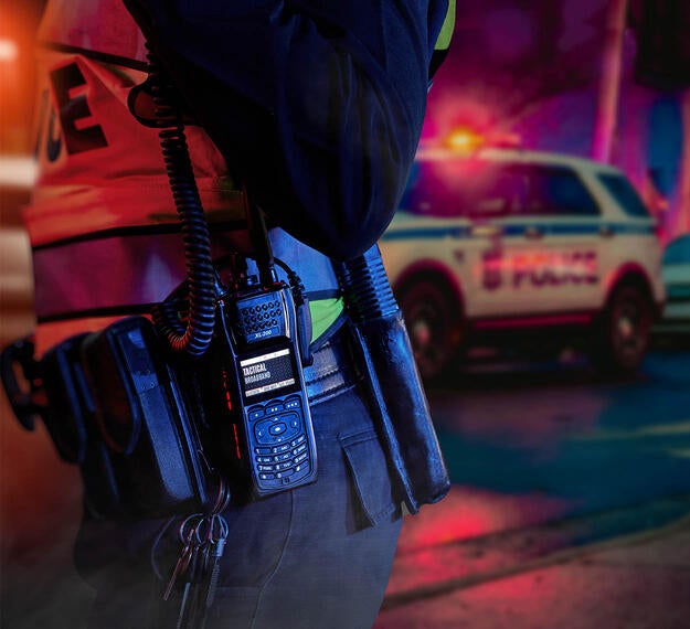 XL Converge™ 200P Multiband Portable Radio and police car