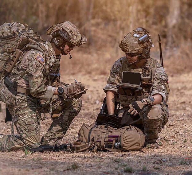 soldiers using communications equipment