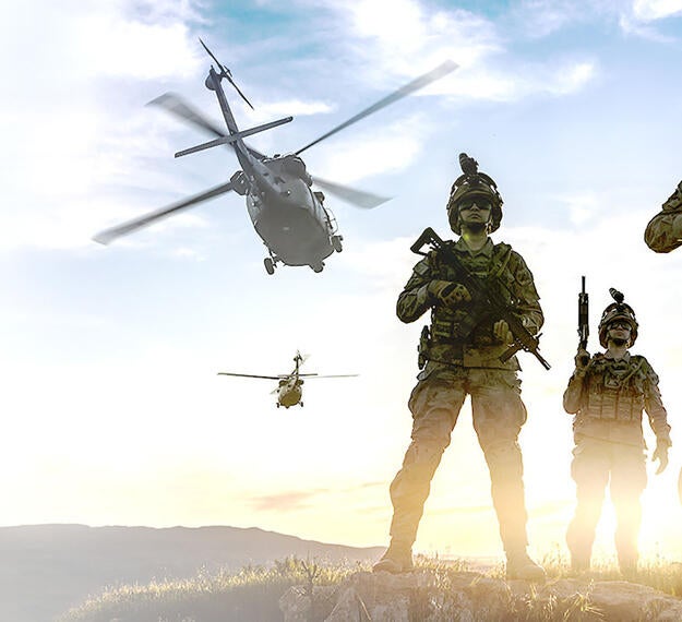 helicopters and soldiers with Small Tactical Terminal (STT) KOR-24A