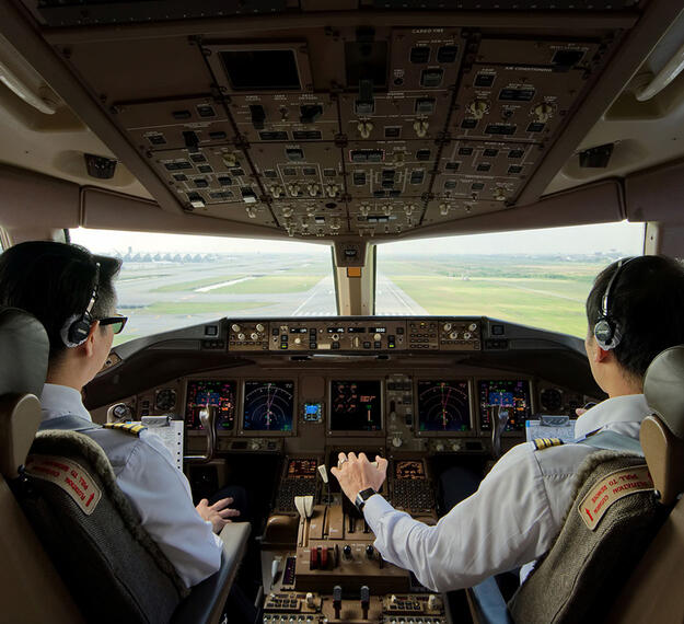 FAA Data Communications Pilots at controls in cockpit