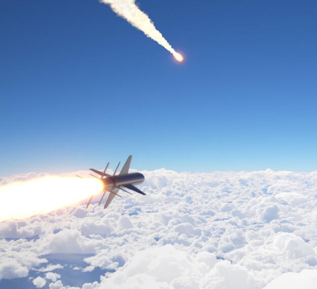Render of Cruise missiles flying above the clouds 