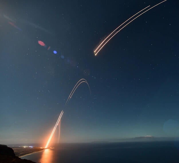 Two ballistic targets soar into the night sky at Pacific Missile Range Facility Barking Sands in Kauai on July 24, 2021.