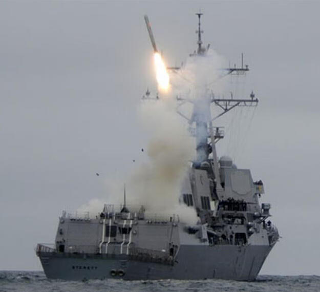 Tomahawk missile launched from destroyer U.S.S. Sterett during weapon test.
