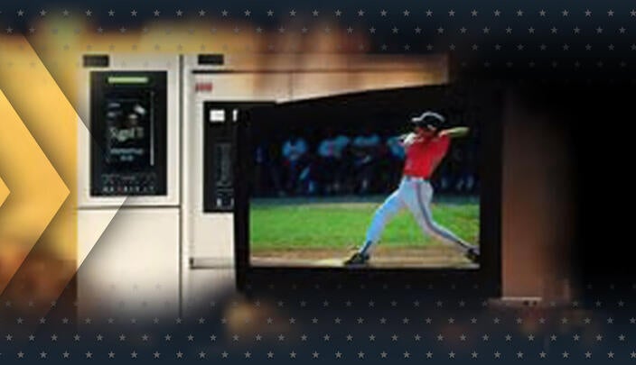 A baseball player hits a ball on a TV screen