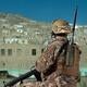 Soldier wearing handheld Falcon® Radio
