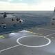 Rendering of helicopter landing on aircraft carrier