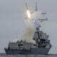 Tomahawk missile launched from destroyer U.S.S. Sterett during weapon test.
