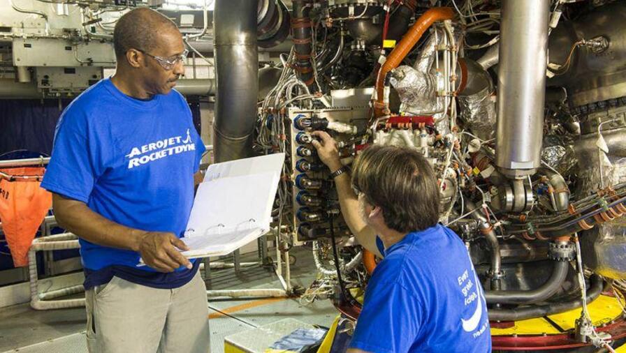 Technicians inspect the RS-25 controller