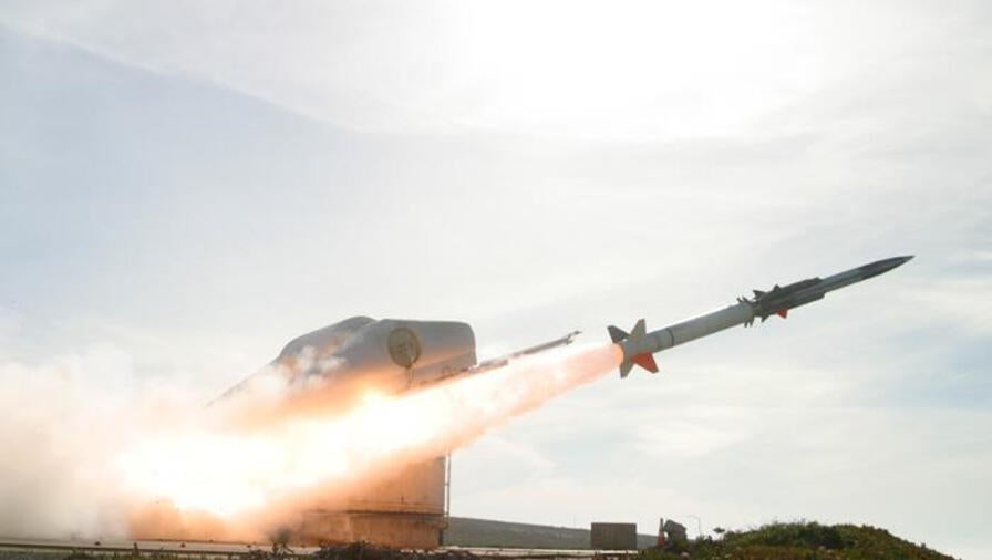 A missile fires from a launcher