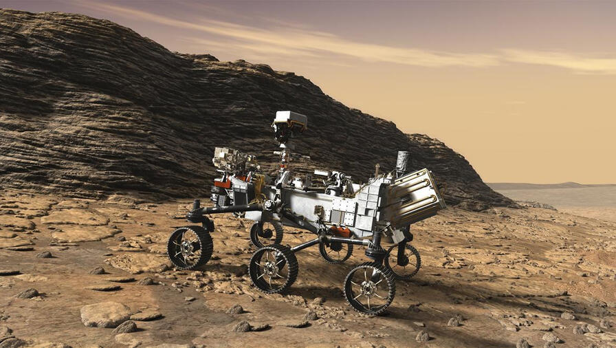A rover roams a desert-like landscape among rough terrain