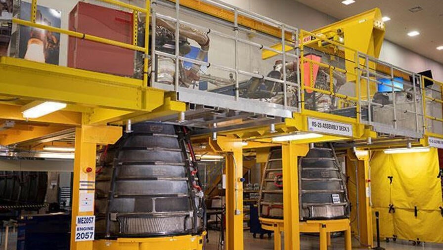 Two engines sit in a facility