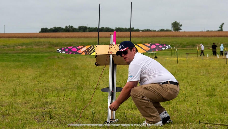 Brian M. preparing his radio-controlled rocket glider for flight (Photo credit: Todd Schweim)