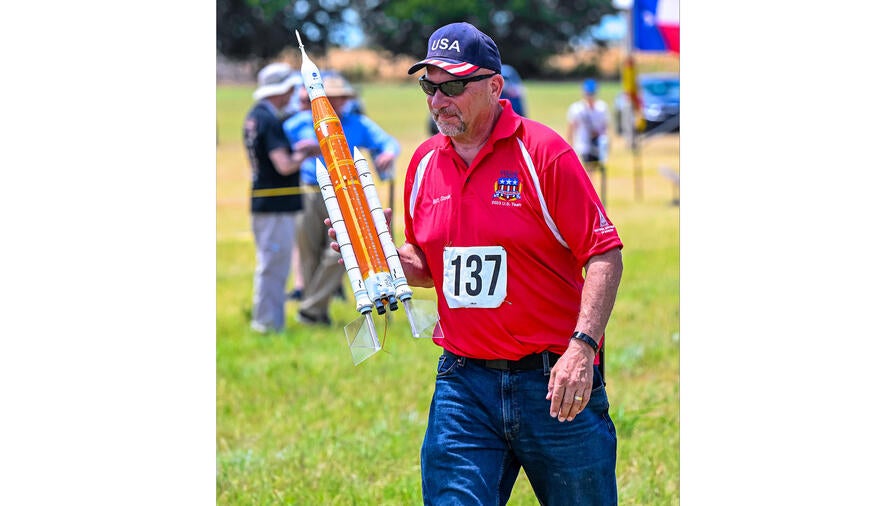 Matt S. carries his SLS model to the launch pad (Photo credit: Jim Wilkerson)