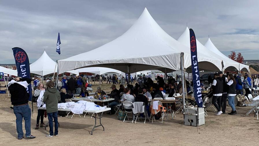 L3Harris tents set-up for US Air Force soldiers celebrating falcon football game